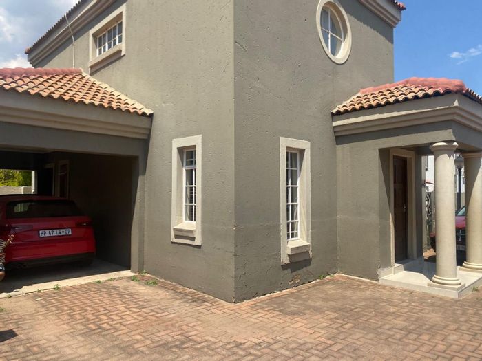 House For Sale in Sherwood Gardens: 2 bedrooms, private garden, secure estate access.