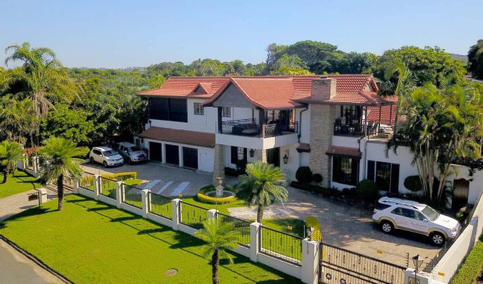 For Sale: House in Umhlanga Central, 9 bedrooms, pool, guesthouse potential.