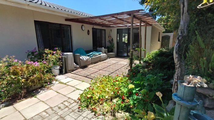 For Sale: House in Dana Bay with garden, open-plan kitchen, braai room, and storage.