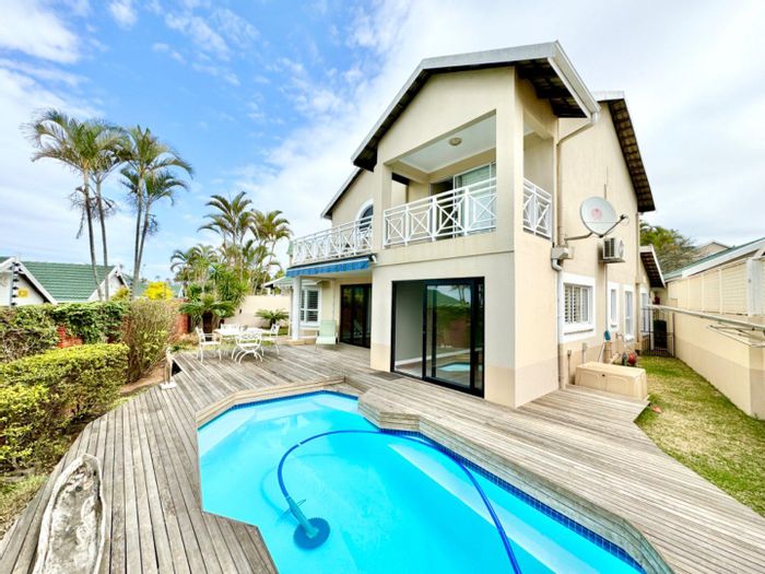 Townhouse To Rent in Umhlanga Central: 3 ensuite bedrooms, pool, eco-friendly features.