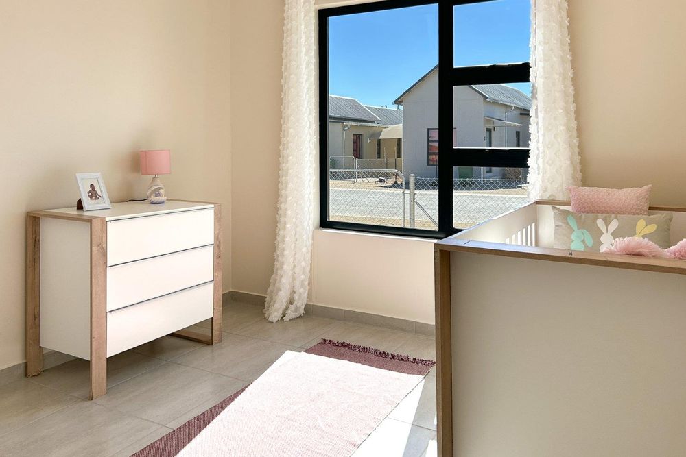 Third bedroom with built-in cupboards.