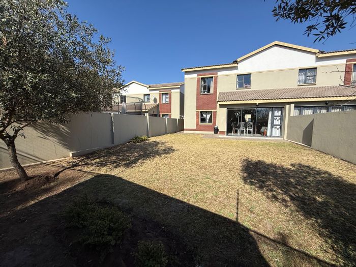 For Sale: 4-Bedroom Townhouse in Equestria with clubhouse, pool, and secure garage.