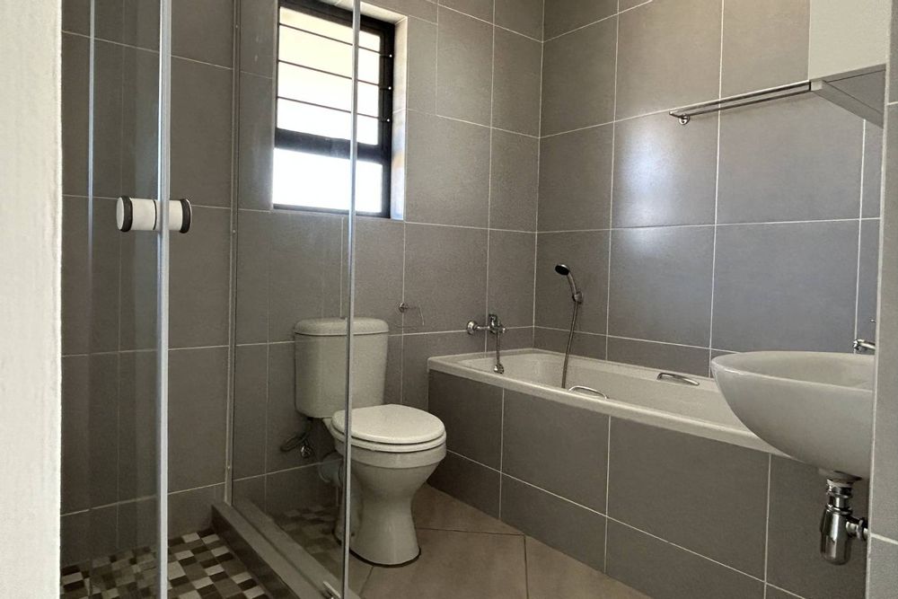 Family bathroom with bath & shower.