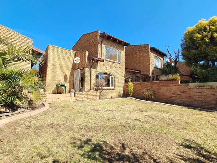 For Sale: Townhouse in Corlett Gardens with private garden, garage, and pool access.