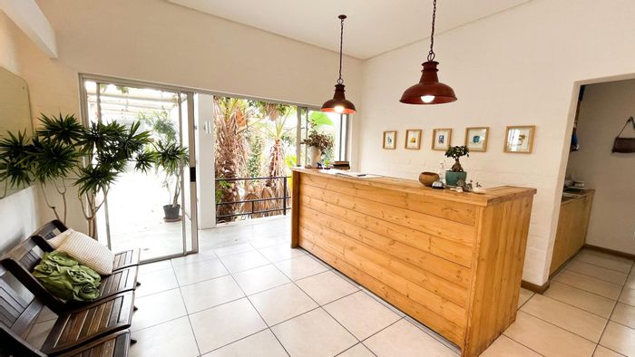 Guest House For Sale in Windhoek Central: 17 rooms, pool, sauna, and garages.