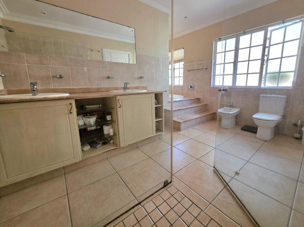 Main bathroom with spacious shower raised jaccuzi double basin and bidet 