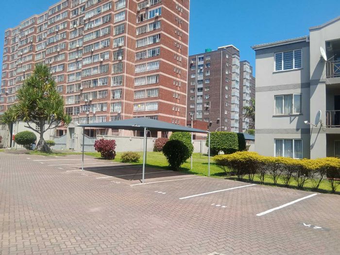 2-Bedroom Apartment For Sale in North Beach with balcony and communal pool.