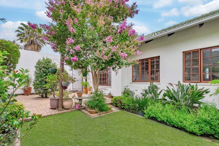 Tranquil Townhouse for Sale in Paulshof with Spacious Kitchen and Manicured Garden