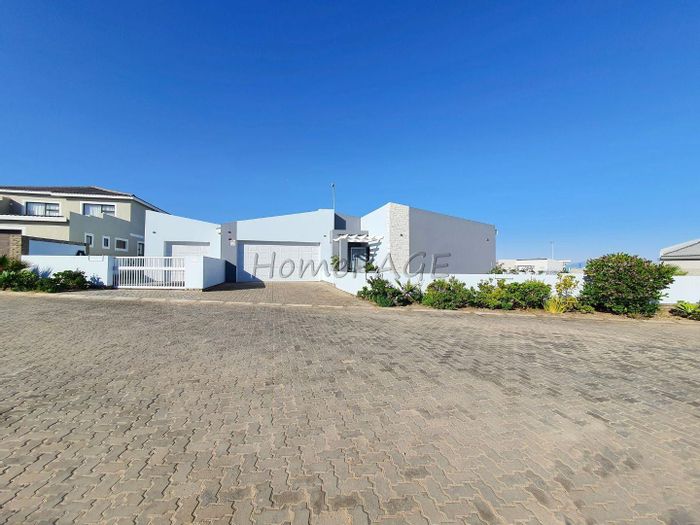 House for Sale in Henties Bay Central: 3 beds, flat, garages, beach access.