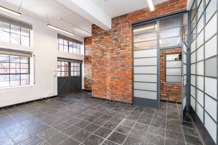 De Waterkant Apartment For Sale: High ceilings, exposed brick, secure parking, pool access.