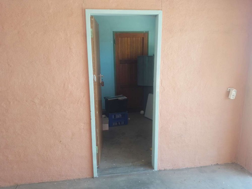 General view of a small store room found at the entrance of the property, currently used as an office. 