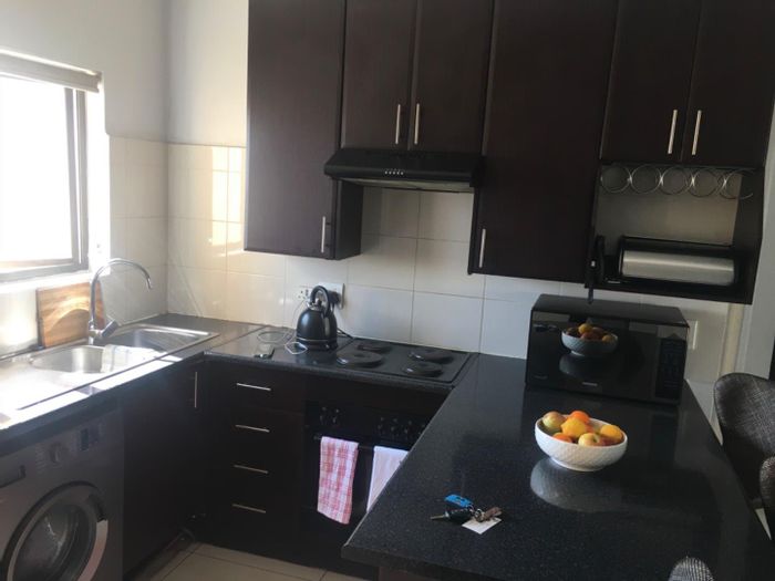 Noordwyk Townhouse For Sale: 2 Bedrooms, balcony, open plan living, covered parking.