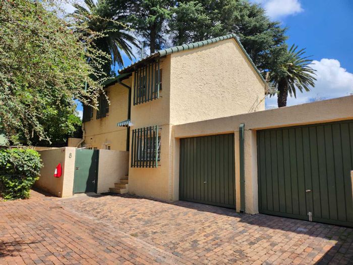 Three-Bedroom Townhouse For Sale in Northcliff with private garden and two garages.