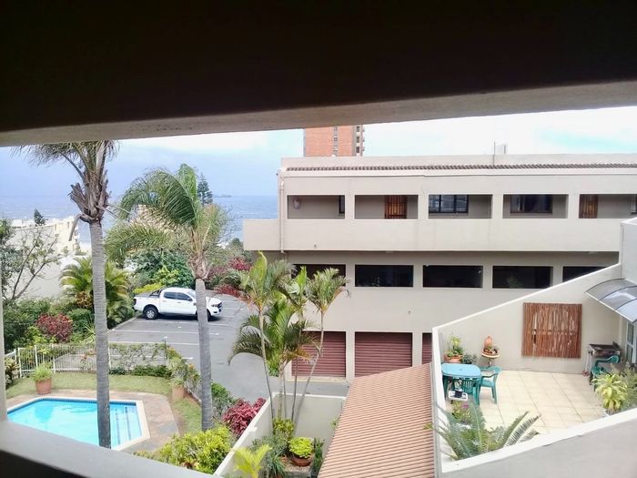 For Sale: 2-Bedroom Apartment in Umhlanga Central with communal pool and patio.