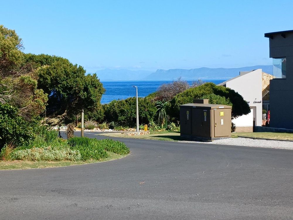 Photo being taken 10 metres away from our Plot. PERMANENT Sea View. Hermanus coastline at the back.