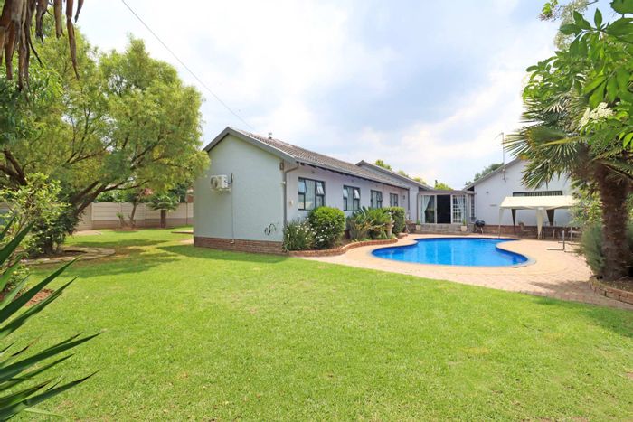 For Sale: Spacious 4-bedroom house in Atlasville with pool and security features.