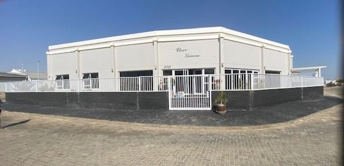 House For Sale in Henties Bay Central: Open-plan living, four en-suites, large garage.