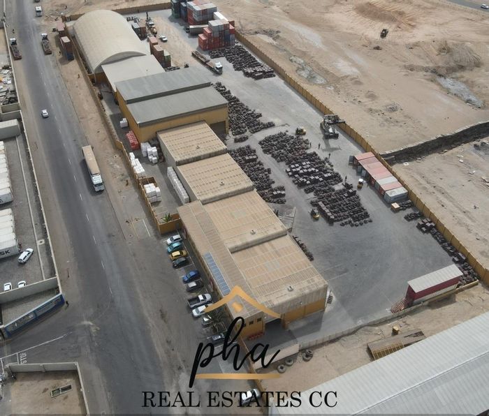 For Sale: Expansive Industrial Property with Harbour, Railway Access, Massive Warehouses, and Office Space