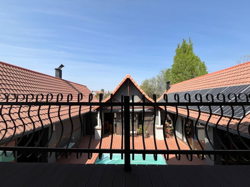 Balcony overlooking swimming pool.