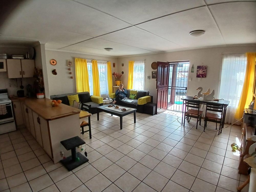 Main Living Area - as from Kitchen. Front door at the back.