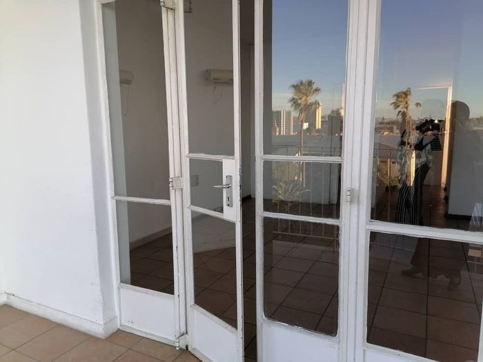 For Sale: Apartment in Windhoek Central with balcony, carport, and security features.