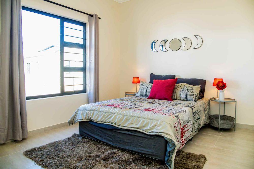 Main bedroom with built-in cupboards.