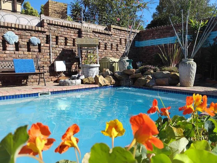 For Sale: Hartenbos Central Townhouse with pool, garden, garage, and security features.