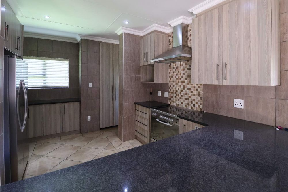 Open-plan kitchen as seen from dining area
