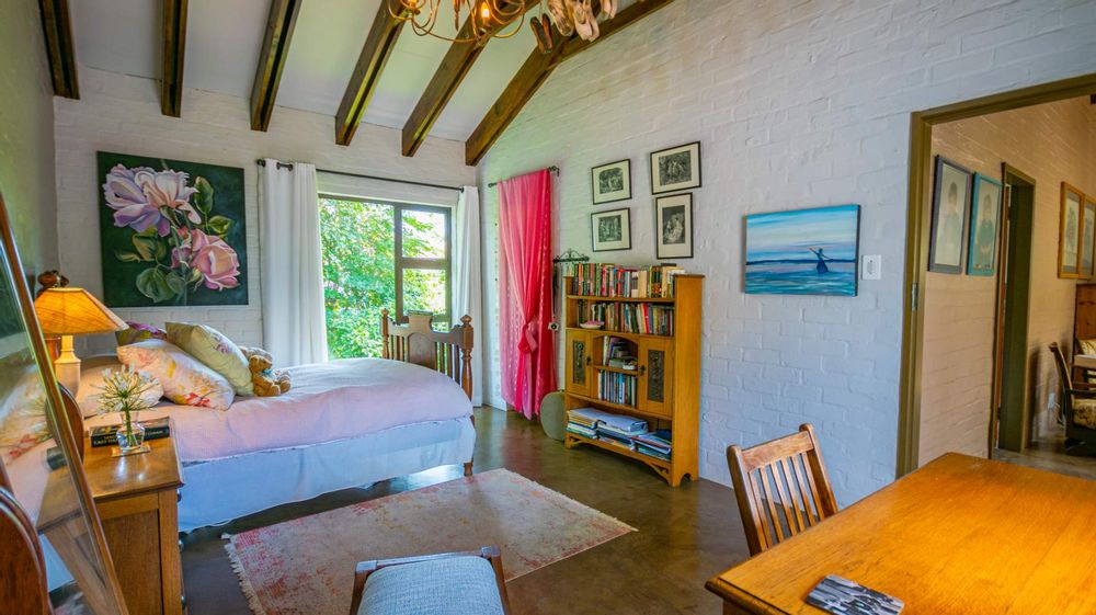 1st of 3 large double sized upstairs bedrooms with a Juliet balcony with view over the greenbelt on one side and treed view on the other side with a stain glass window for added ambience