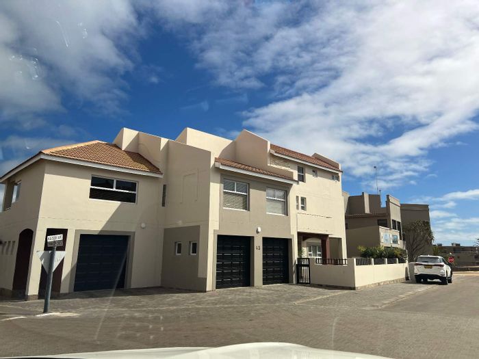 Spacious Long Beach house with 6 bedrooms, ocean views, and triple garage. For Sale.