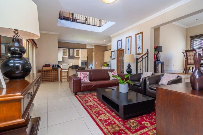 For Sale: Spacious 5-bedroom house in Ruimsig with pool, double garages, and community feel.