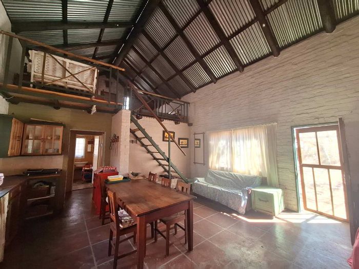 House for Sale in Leeupoort Central: One-bedroom with loft, versatile spaces, bushveld retreat.