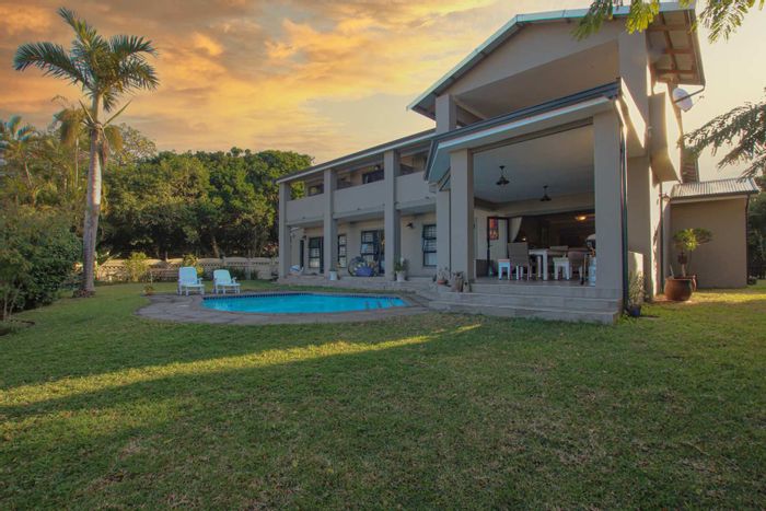 For Sale: 8-Bedroom House in Umhlanga Central with pool, guest house, and sea views.