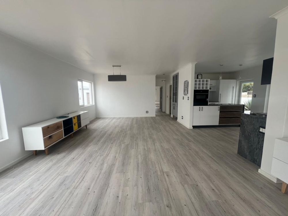 Open-plan kitchen, lounge and dining room upon entry