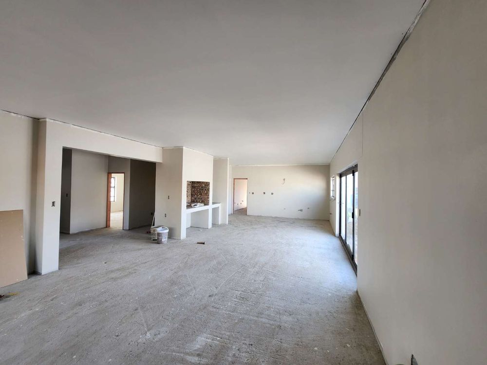Open plan kitchen and living room with build-in braai.