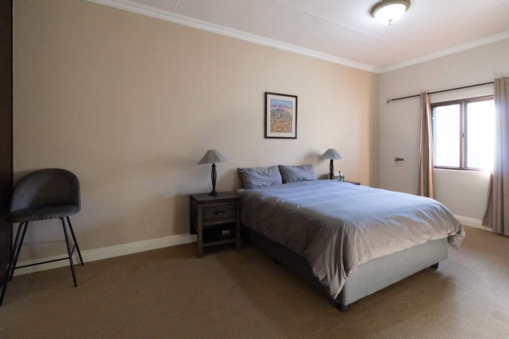 Spacious main bedroom with air-conditioner