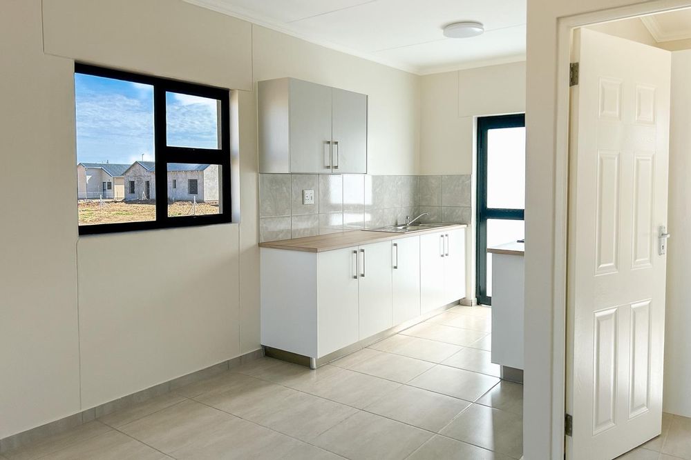 Modern kitchen with built-in cupboards and built-in oven.