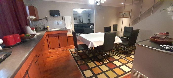 Spacious 4-bedroom house in Sunford with double garages and outdoor area. For Sale.