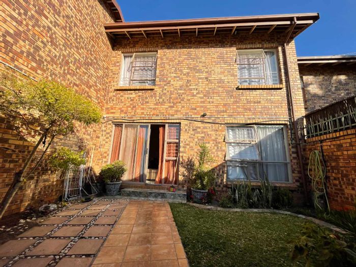Two-Bedroom Townhouse For Sale in Weavind Park with garden and braai area.