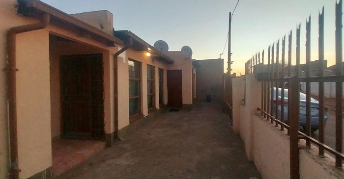 For Sale: House in Winnie Mandela with garage, gated security, and four outside rooms.