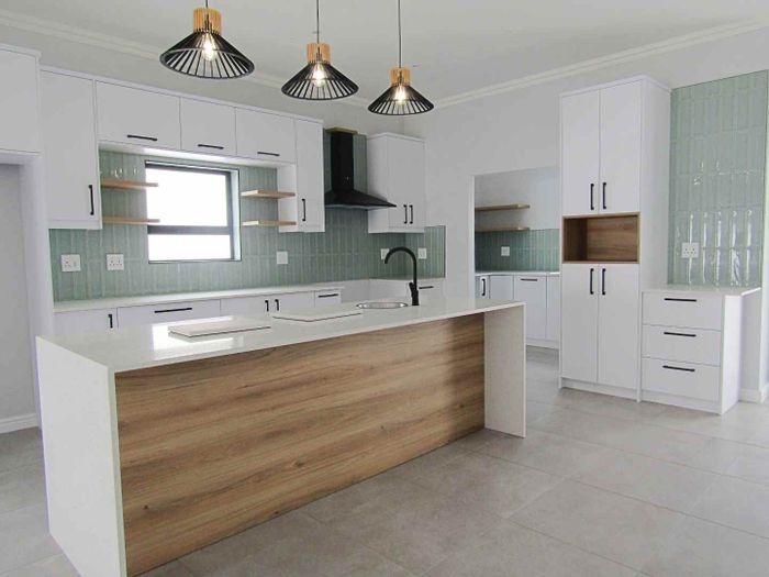 Coastal house for sale in Sandy Point with pool, security, and beach access.