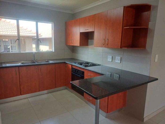 Rynfield Apartment For Sale: Secure complex, open-plan living, communal braai, jungle gym.