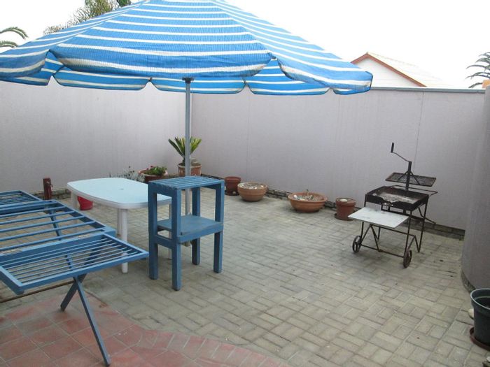 Stylish Apartment in Hage Heights For Sale: Garden Courtyard, Secure Parking, Modern Amenities