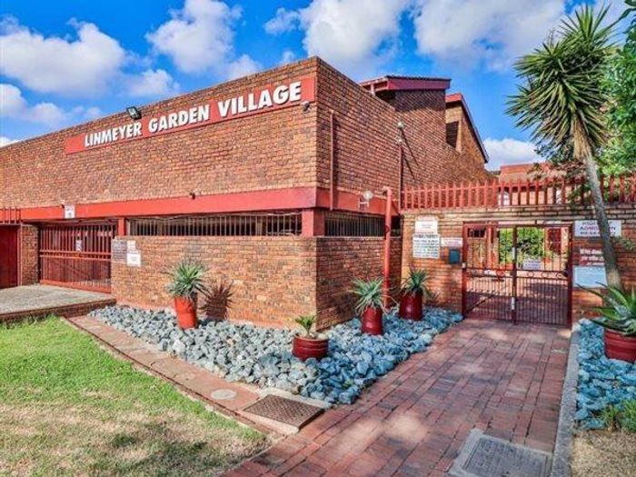 Townhouse For Sale on The Hill: 2 beds, private outdoor space, secure parking.