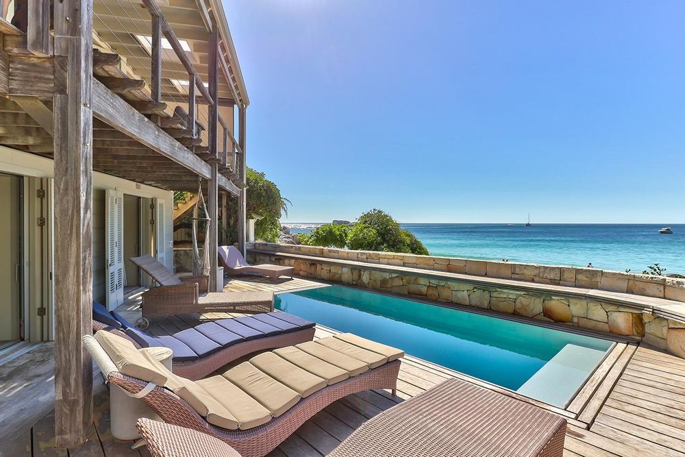 Private pool deck with beach and ocean views