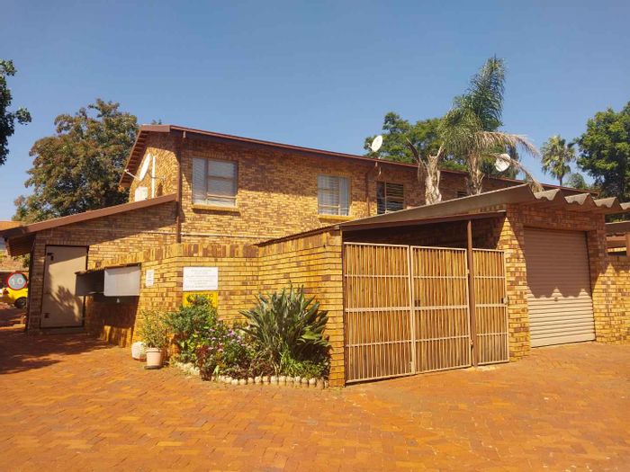 3-Bedroom Townhouse To Rent in Weavind Park with garden, braai area, and laundry.