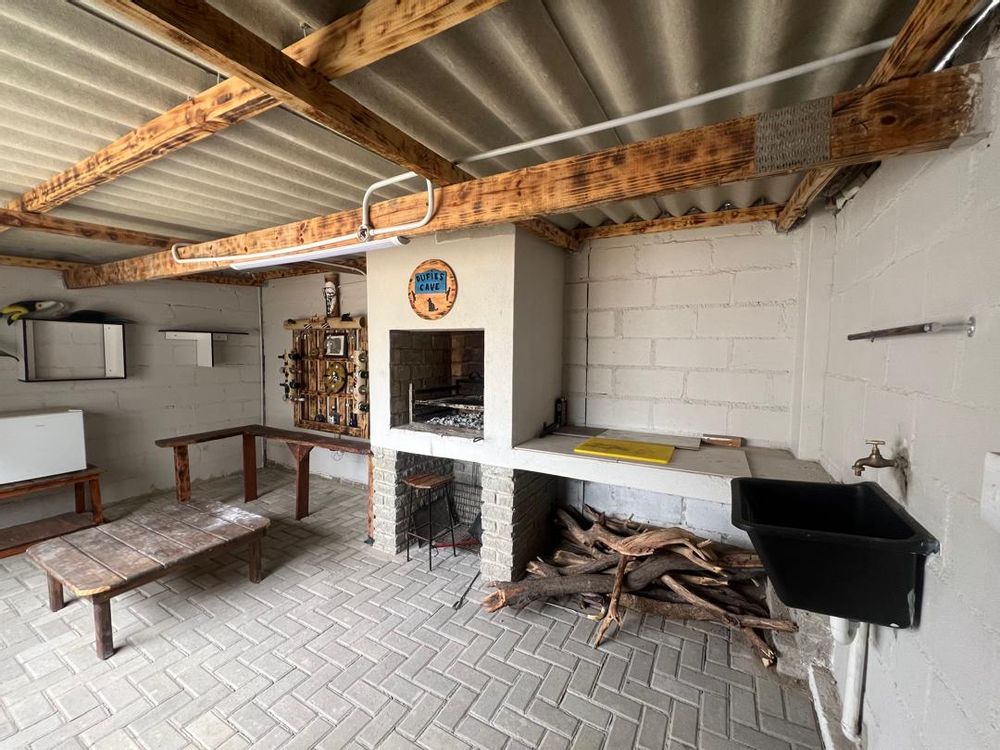 Back courtyard entertainment room with BBQ