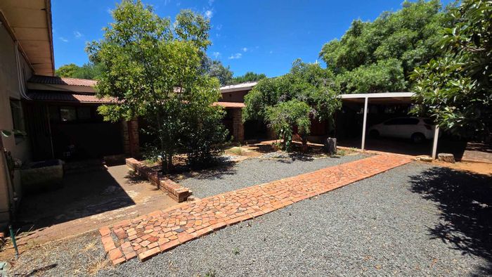 For Sale: House in Universitas with 11 rental units, pre-paid utilities, and parking.