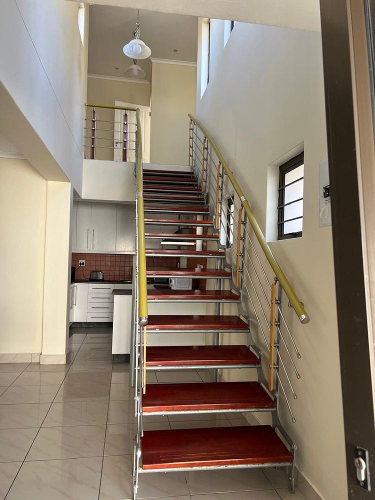 over view of stairs and kitchen