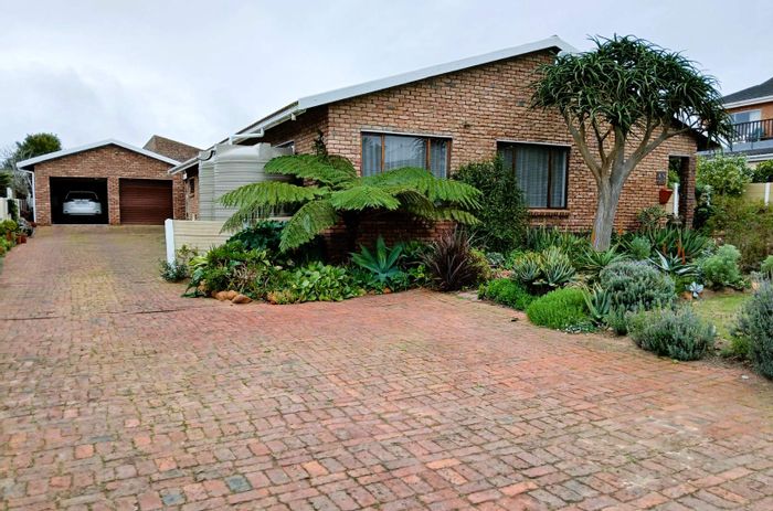 For Sale: 3-bedroom house in Still Bay West with garden, double garage, and water tanks.